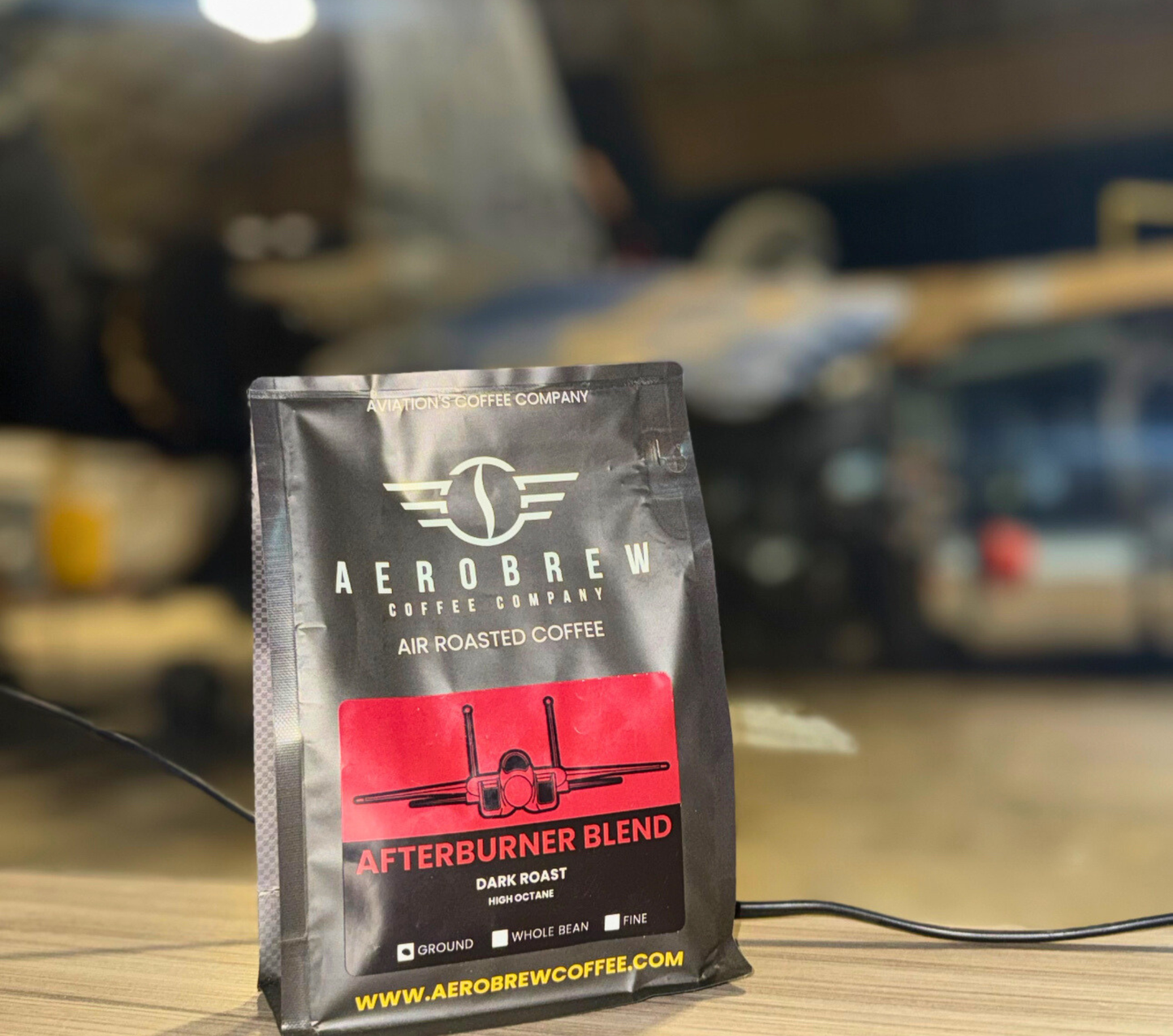 Aerobrew coffee package on a table with a blurred background