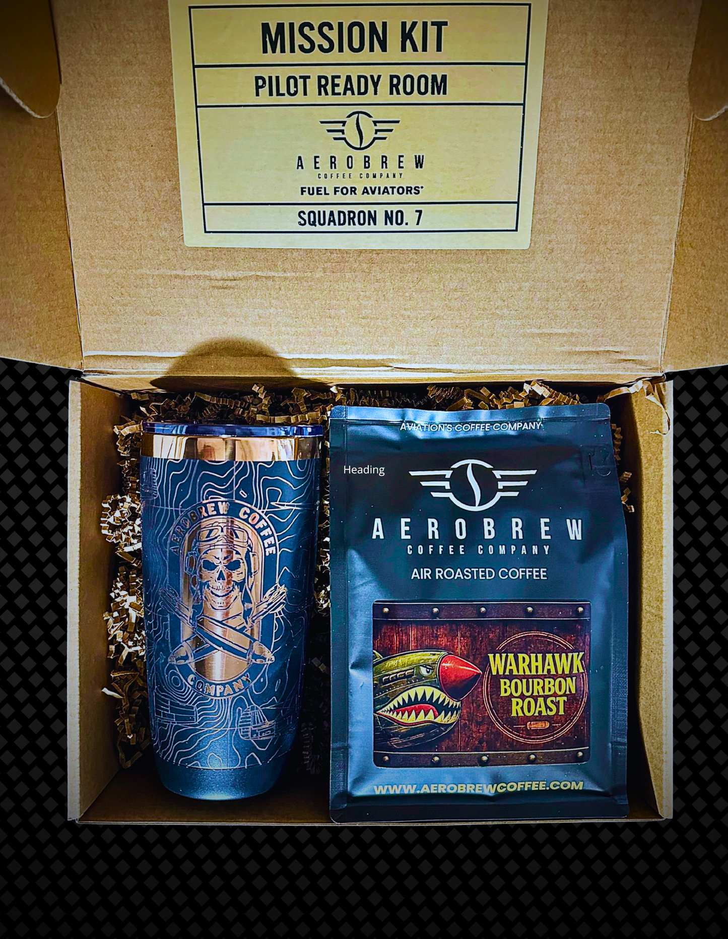 AeroBrew coffee package with a tumbler and coffee bag in a cardboard box labeled 'Mission Kit'.