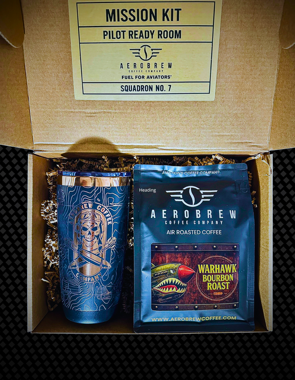 AeroBrew coffee package with a tumbler and coffee bag in a cardboard box labeled 'Mission Kit'.