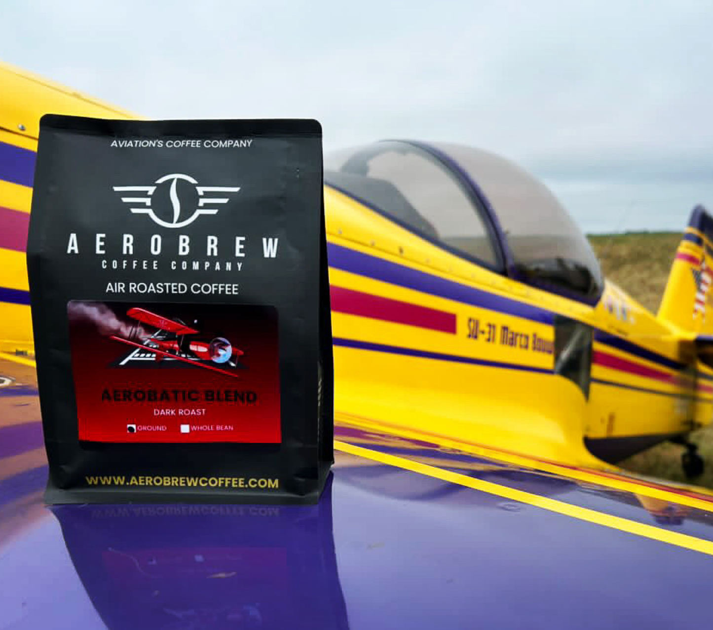 Aerobrew coffee package in front of a small airplane