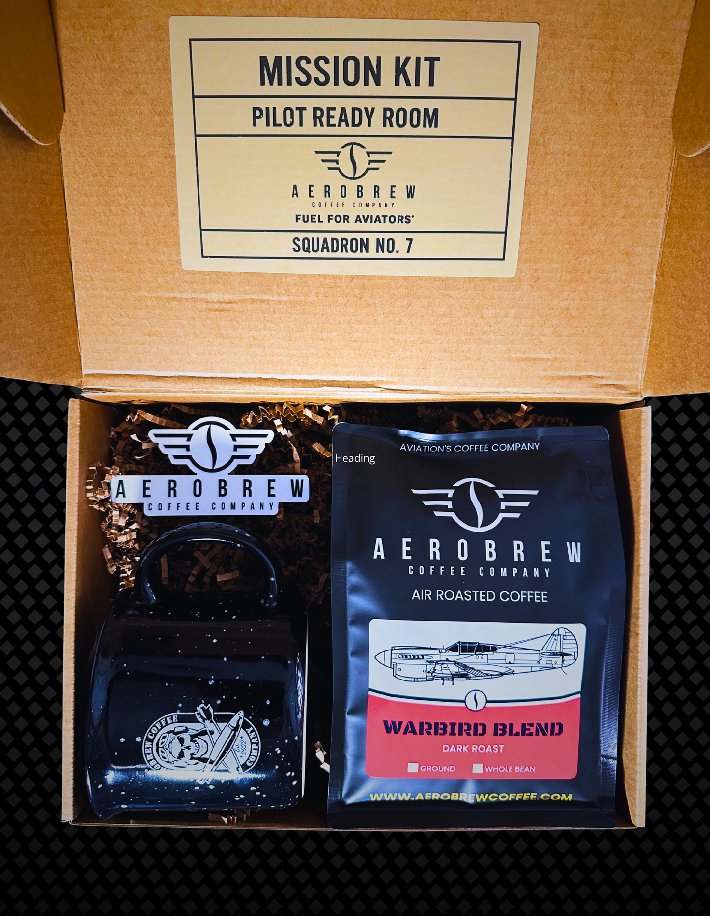 AeroBrew coffee kit with coffee bag and carafe in a cardboard box.