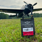 Aeros Brew coffee package in front of a vintage airplane on grass