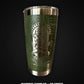 Green tumbler with a metallic finish on a black background