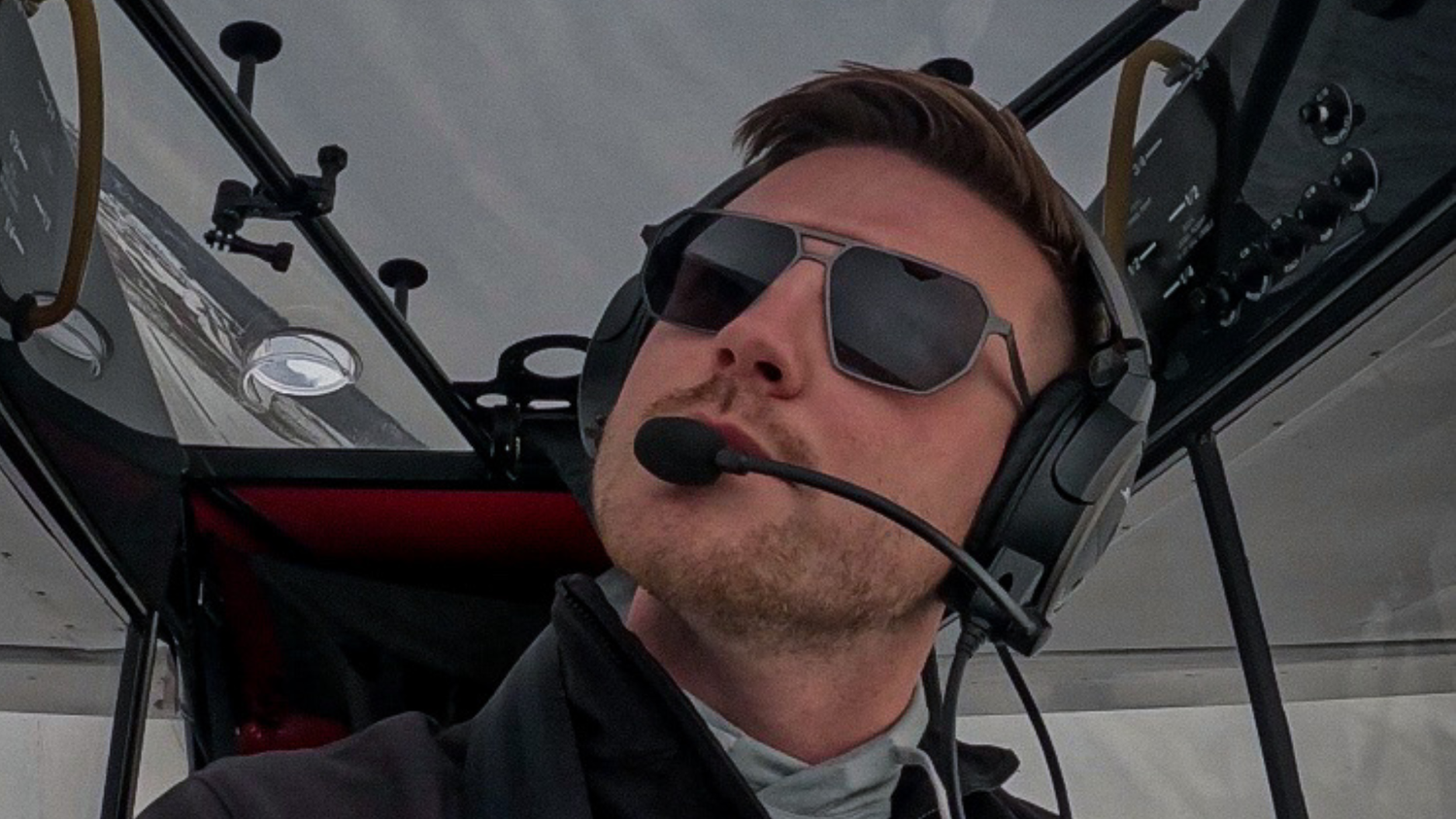 Pilot wearing the best pilot sunglasses skyrift eyewear in airplane cockpit